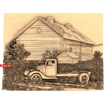 An old truck near a barn